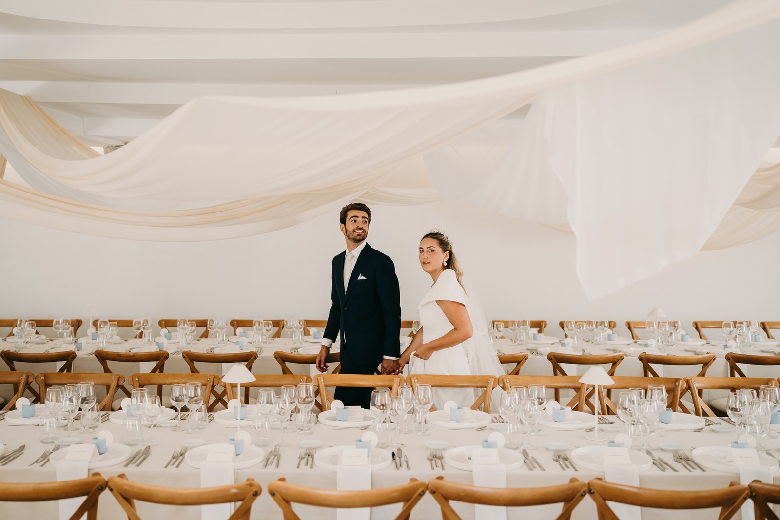 The reception hall at Quinta do Boiro, draped and set for a wedding dinner
